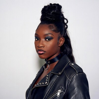 African-American woman in leather jacket choker