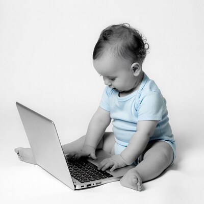 Baby typing on laptop