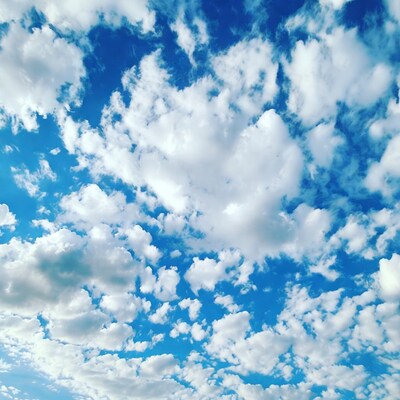 Fluffy Clouds in Blue Sky