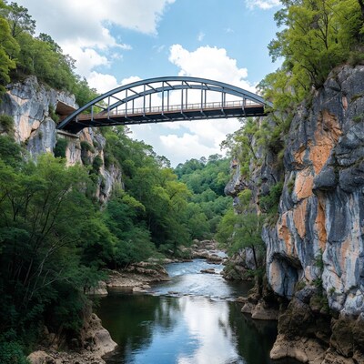 Steel arch bridge over river canyon