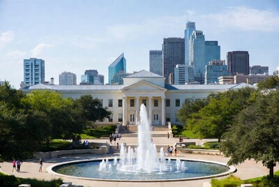 Fountain in front of museum with skyline