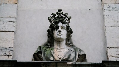 Weathered stone king bust sculpture
