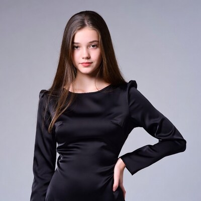 Teen girl in black satin dress