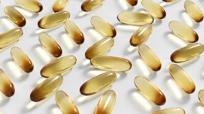 Golden Fish Oil Capsules on White