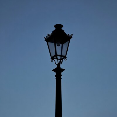 Vintage street lamp silhouette at dusk