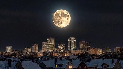 Full Moon Over Snowy City Skyline