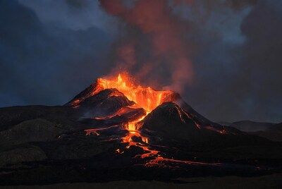 Volcano erupting with lava flows