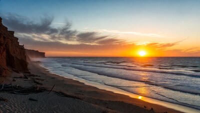 Sunset over beach with red cliffs