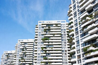 Modern White Skyscrapers with Green Balconies