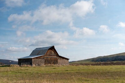 Rustic barn in grassy field