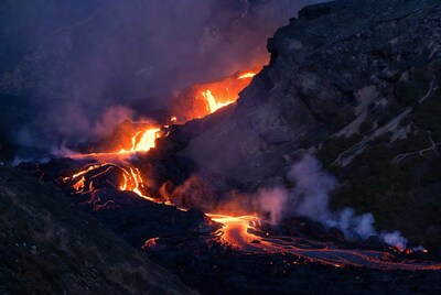 Glowing Lava Flowing Down Volcanic Slope