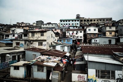 Crowded urban slum with graffiti buildings