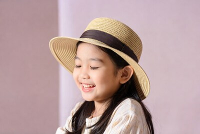 Asian girl smiling in straw hat