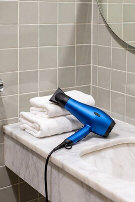 Blue hair dryer on towels