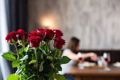 Red Roses Bouquet with Blurred Woman