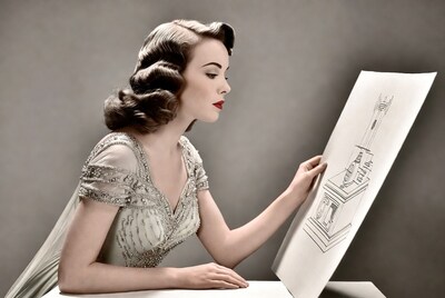 Woman examining architectural drawing