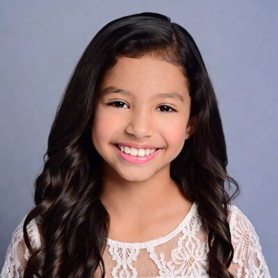 Smiling Latina girl with long curly hair
