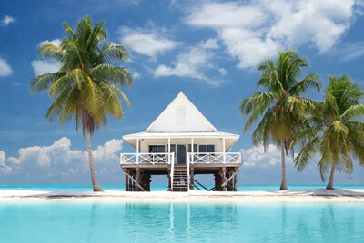 White stilt house on tropical sandbar