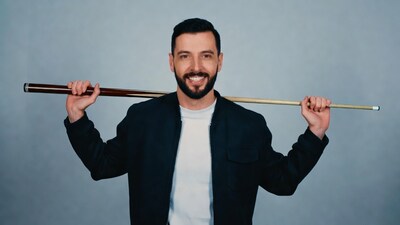 Man holding pool cue