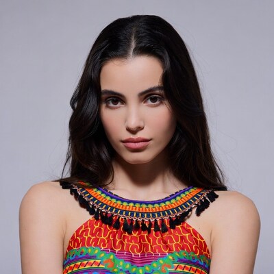 Woman in colorful tassel top