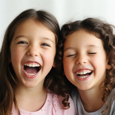 Two girls laughing together