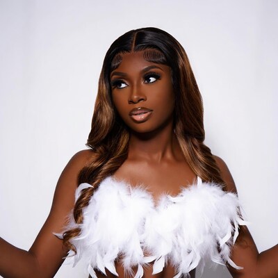 African-American woman in white feather top