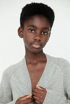 African boy in gray cardigan