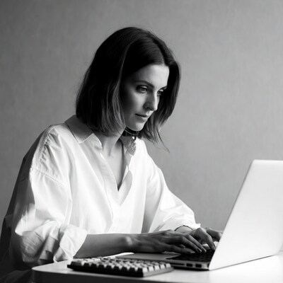 Woman typing on laptop