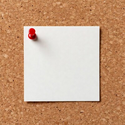 Blank note pinned to corkboard