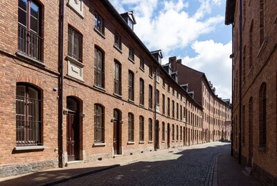 Brick buildings lining cobblestone alley