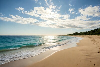 Turquoise Ocean Beach with Footprints