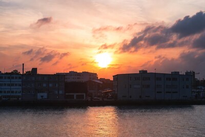 Sunset over riverside buildings