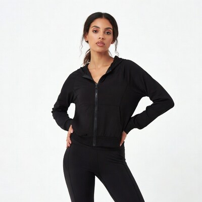 Woman in black hoodie and leggings