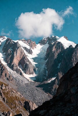 Heart Cloud Over Snowy Mountains