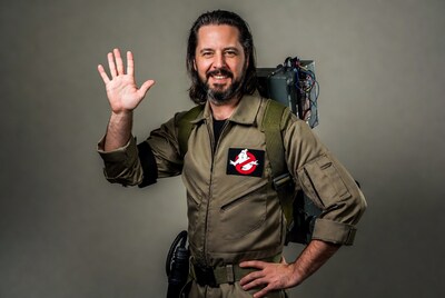 Man waving in Ghostbusters costume