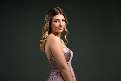 Young woman in mauve prom dress
