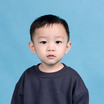 Asian boy on blue background