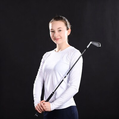 Young woman holding golf club