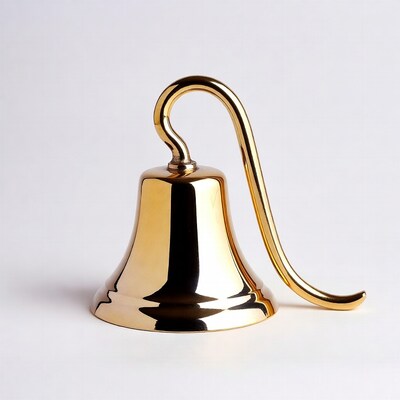 Golden Hand Bell on White