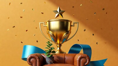 Golden Trophy on Armchair with Confetti