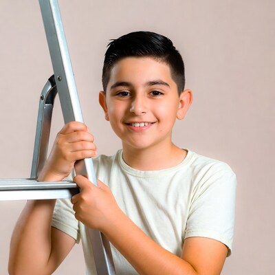 Boy holding metal ladder