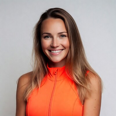Smiling woman in orange jacket