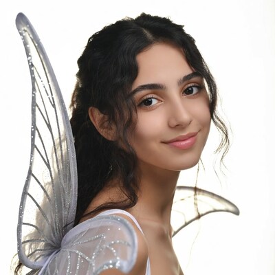 Girl with fairy wings smiling