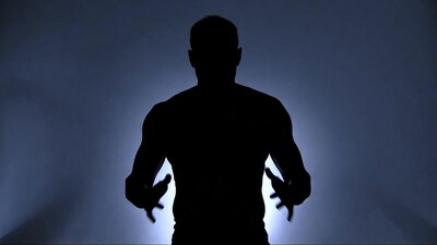 Muscular man silhouette spreading arms