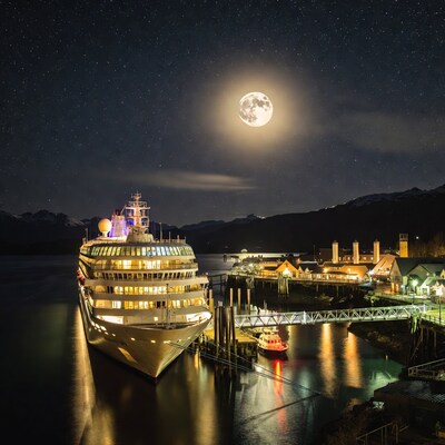 Cruise Ship Docked at Night with Moon