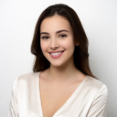 Smiling woman in white satin top
