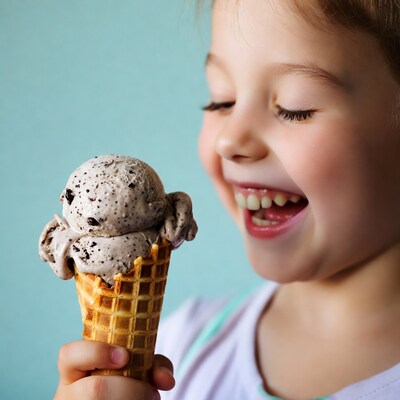 Girl holding cookies and cream ice cream cone