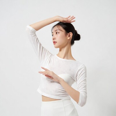 Asian woman posing with hand on head