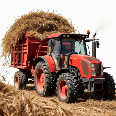Red tractor hauling hay bales