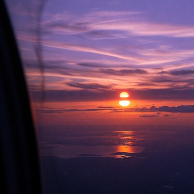Double Sun Sunset from Airplane Window